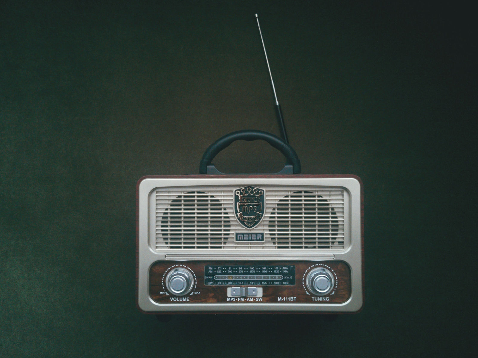 old radio on green background